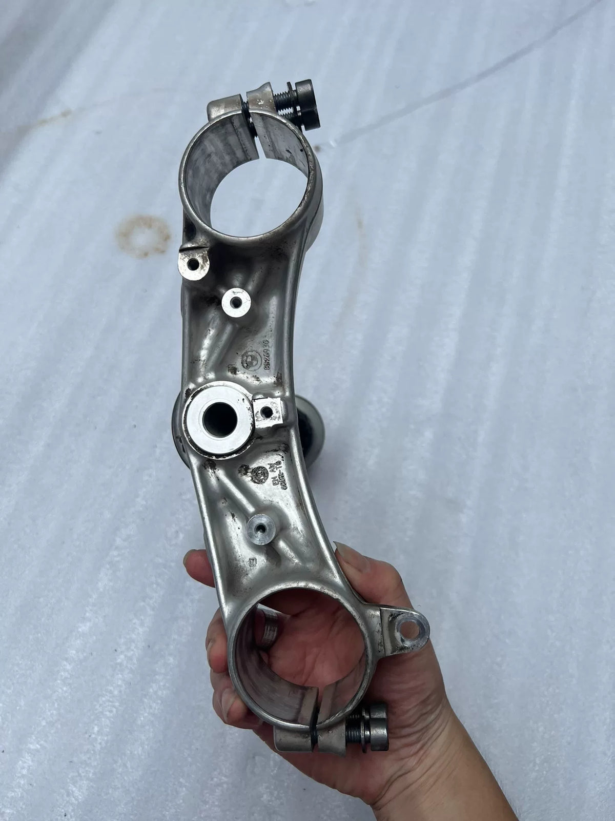 BMW S1000RR triple clamp rear angle view showing underside detail and mounting hardware interface