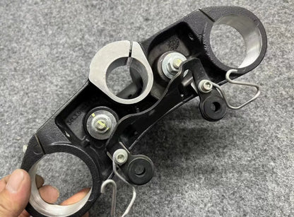 Ducati Monster 821 lower triple tree clamp close-up showing bearing race seat and fork tube holes