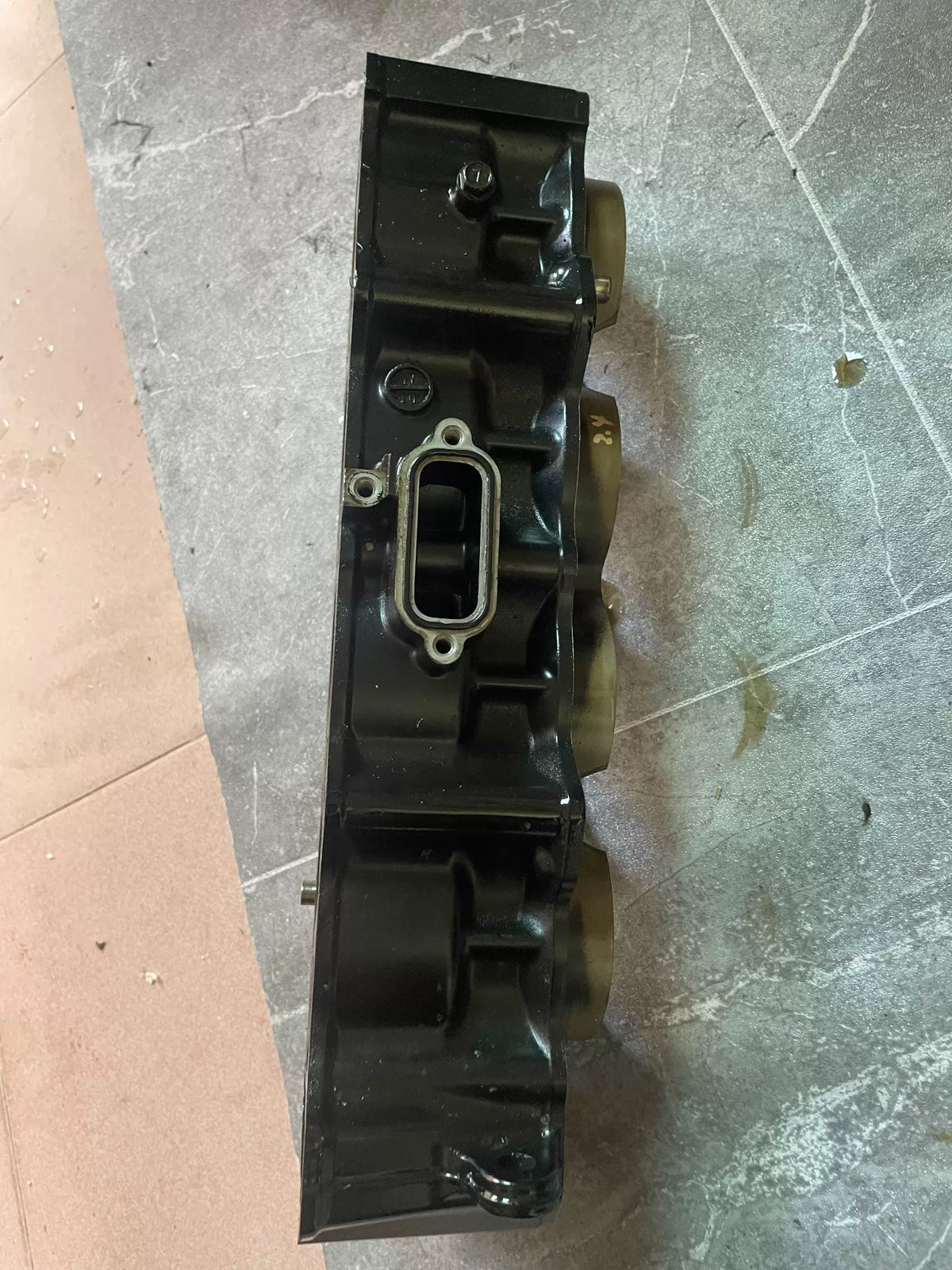 Kawasaki Z900 cylinder block bottom view showing crankcase mating surface and oil passages