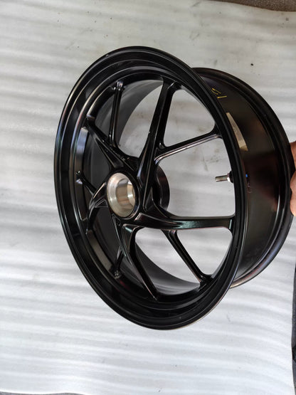 Ducati Panigale V2 rear wheel, reverse side view showing sprocket carrier flange and axle area