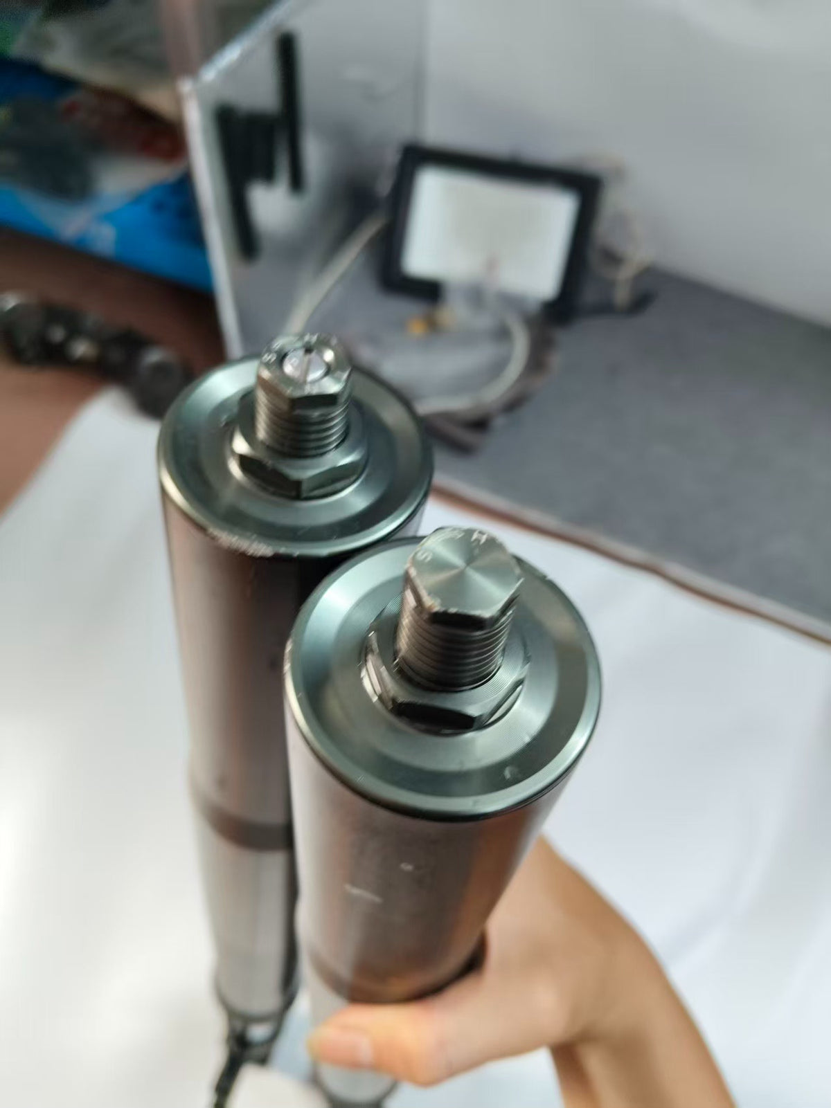 Right fork damper assembly black Versys 1000, angled view showing full assembly with axle clamp bottom