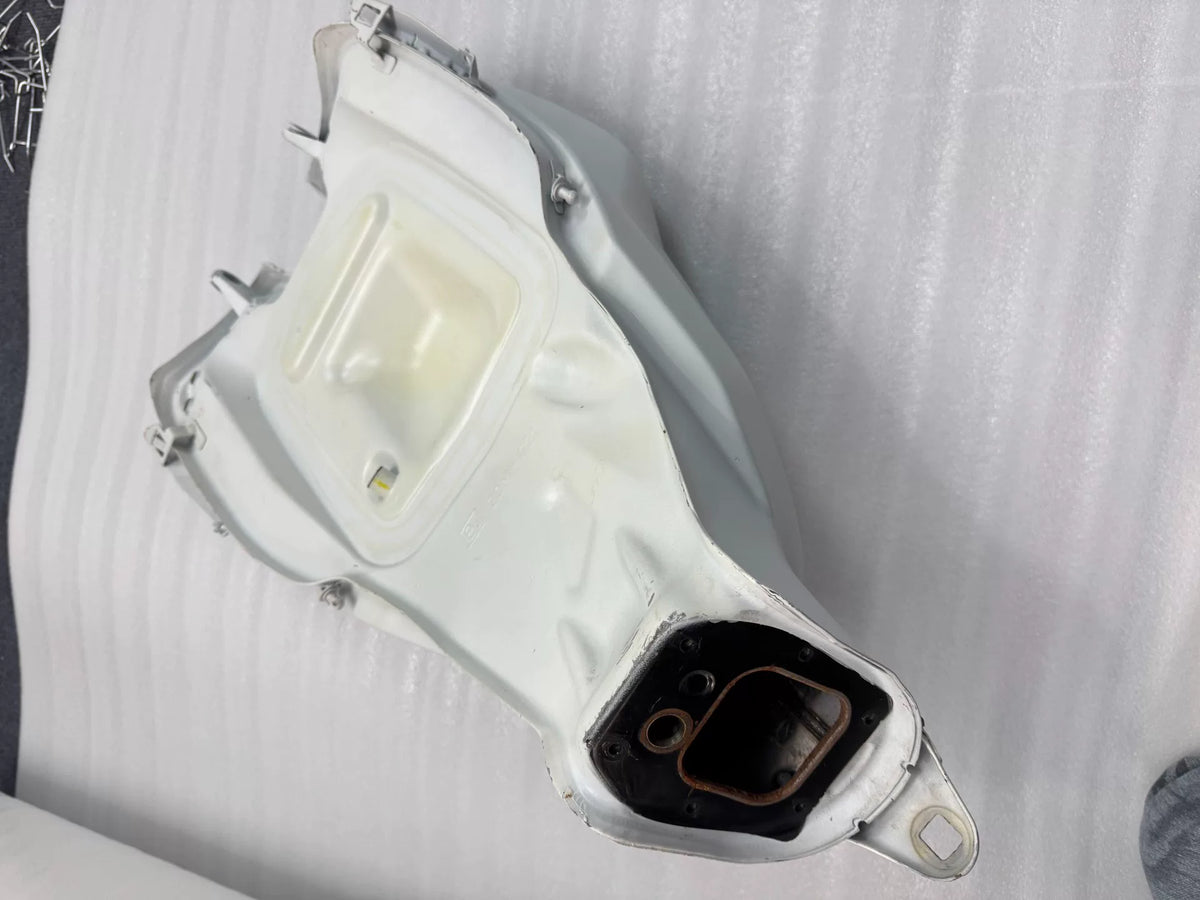 White Panigale V2 fuel tank close-up of left side panel showing paint condition and surface detail
