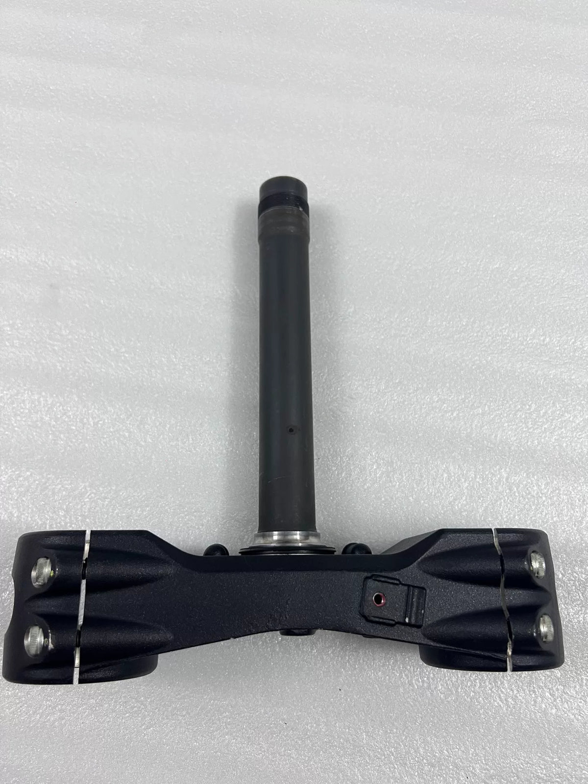 Lower fork yoke Ducati Multistrada 1200, angled view of fork leg clamp bosses and hardware holes