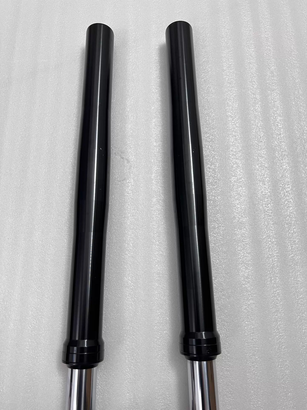 Yamaha YZF-R3 front fork assembly, lower leg close-up showing axle clamp and condition