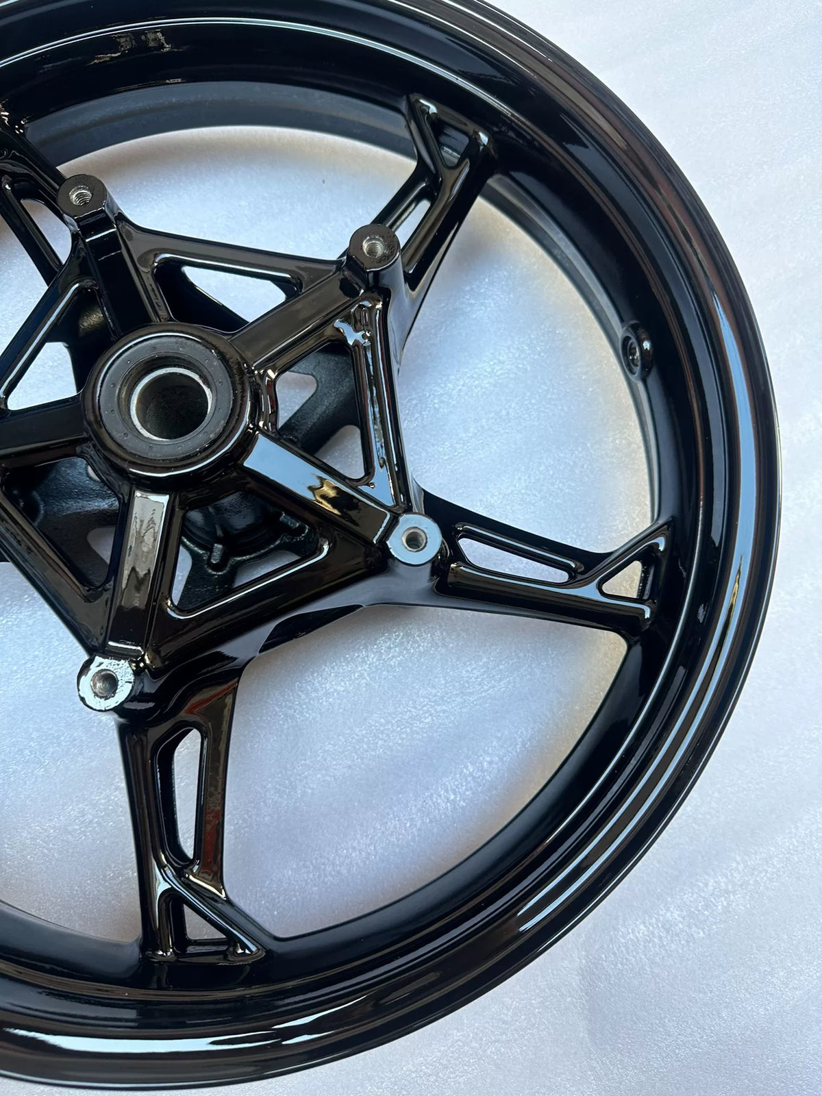 BMW S1000RR front wheel rear-facing angle showing spoke undersides and rim channel