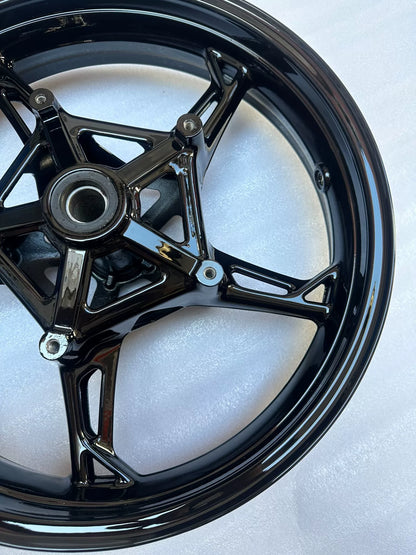 BMW S1000RR front wheel rear-facing angle showing spoke undersides and rim channel