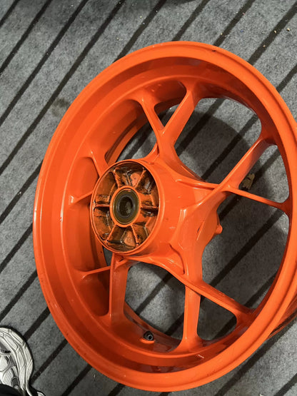 Complete orange electric wheel for KTM 790 Duke, top-down view of rim and hub