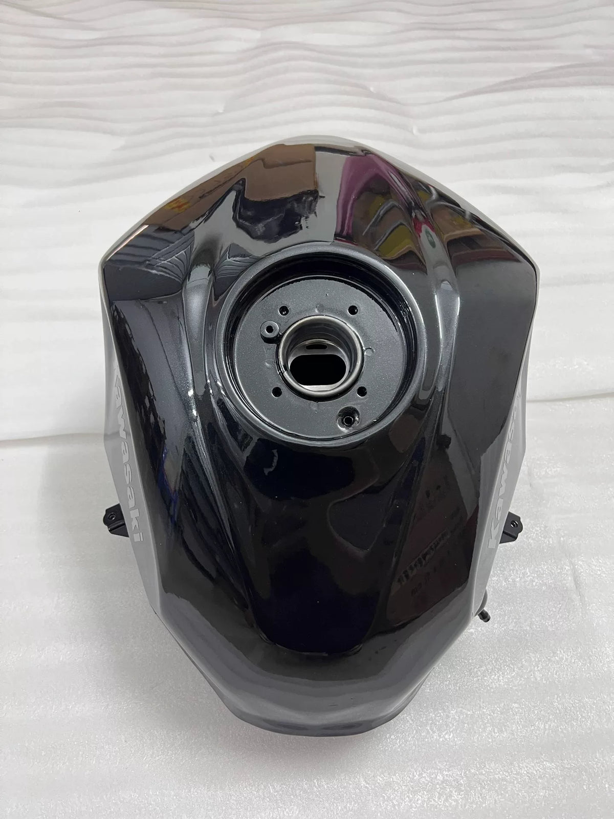 Kawasaki Ninja 400 fuel tank close-up of filler neck and cap assembly, no damage visible