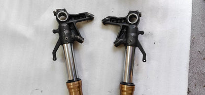 Kawasaki ZX-10R front fork upper tube end cap and adjuster detail, top-down close-up