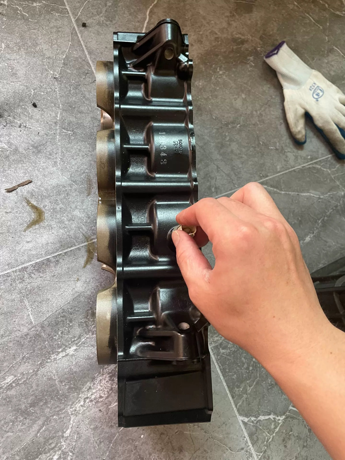 Kawasaki Z900 engine middle block side view highlighting water jacket ports and gasket surface