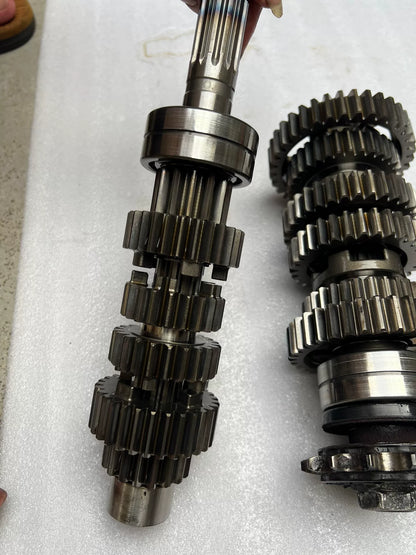 Z900RS gearbox disassembled view showing individual gear sets, shafts and shift components laid out