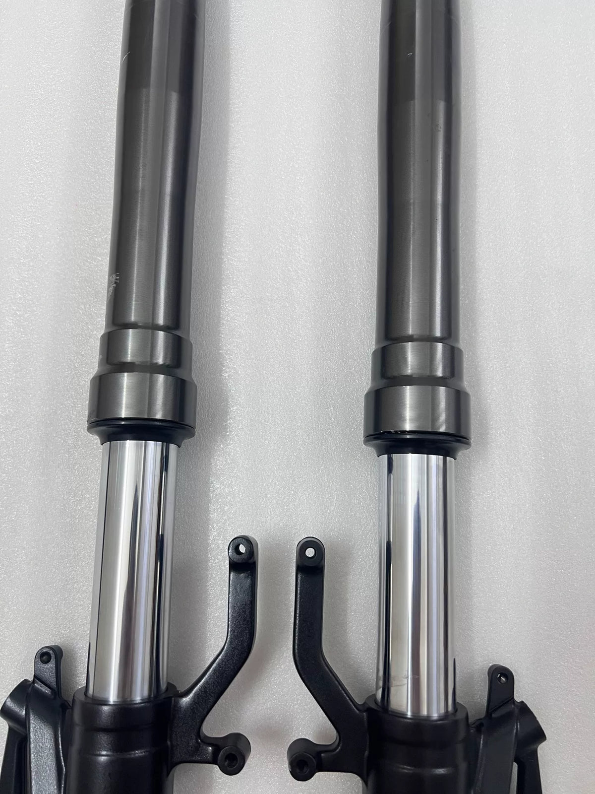 Kawasaki Ninja 1000 SX 2020-2025 front fork lower leg casting detail, damping adjuster and drain screw visible