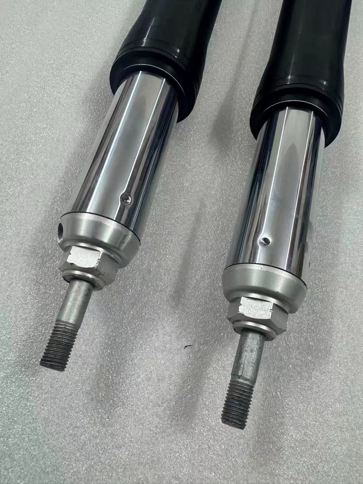 BMW R1200GS fork rods pair, slightly angled 3/4 view highlighting length and chrome surface
