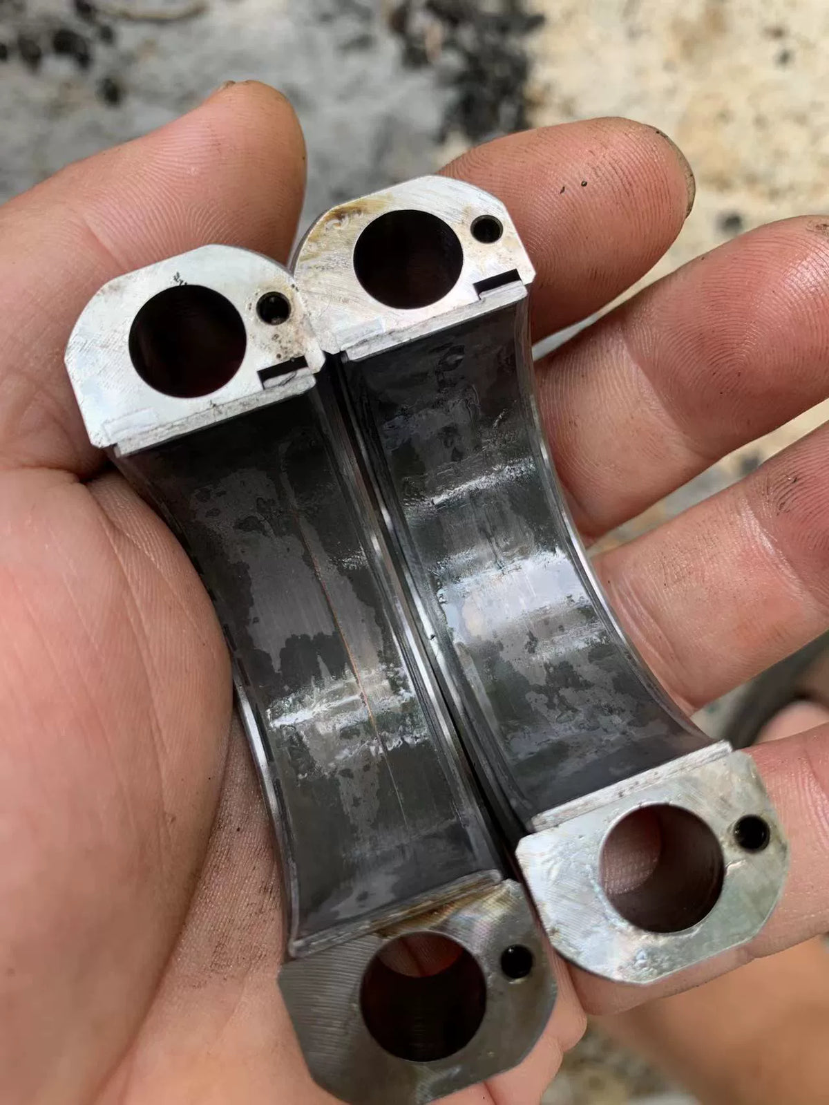 Ducati 1098 crankshaft set, angled rear view highlighting connecting rod pins and precision ground surfaces