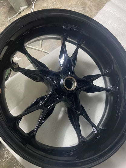 BMW C400X rear wheel rim, angled view showing rim width and sprocket carrier flange