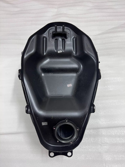 Kawasaki Ninja 400 fuel tank underside view revealing petcock port and frame mounting hardware