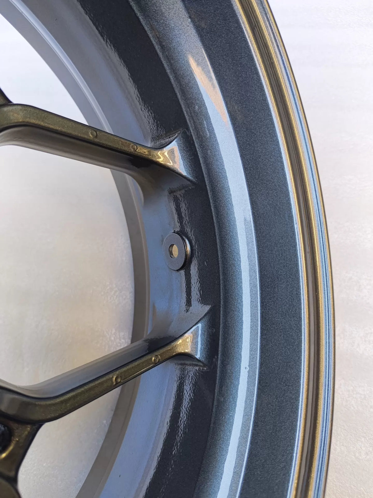 Honda CBR650R rear wheel, brake disc mounting flange close-up detail