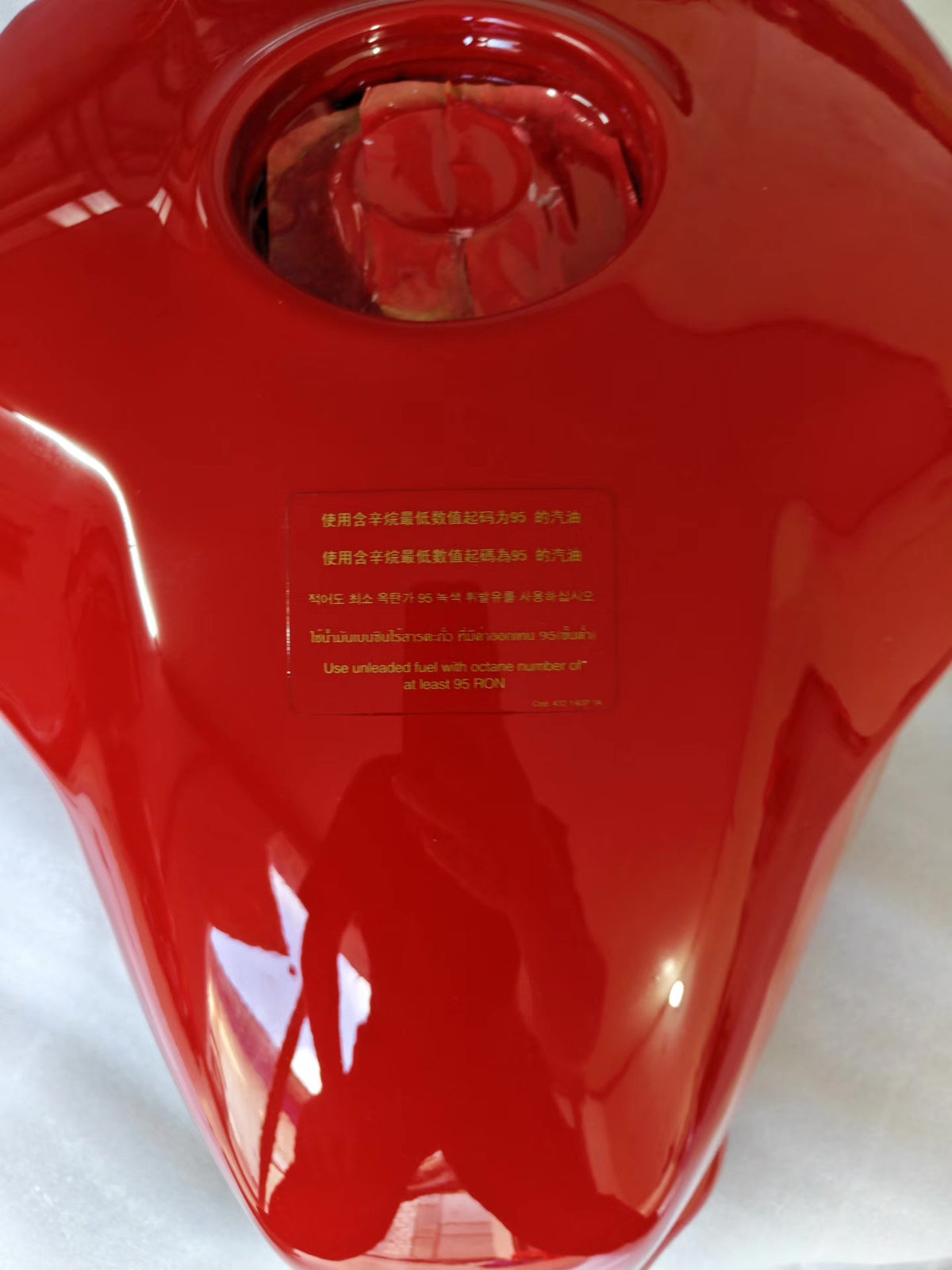 Red fuel tank for Ducati SuperSport 939, top-down view of full tank shape and filler neck position