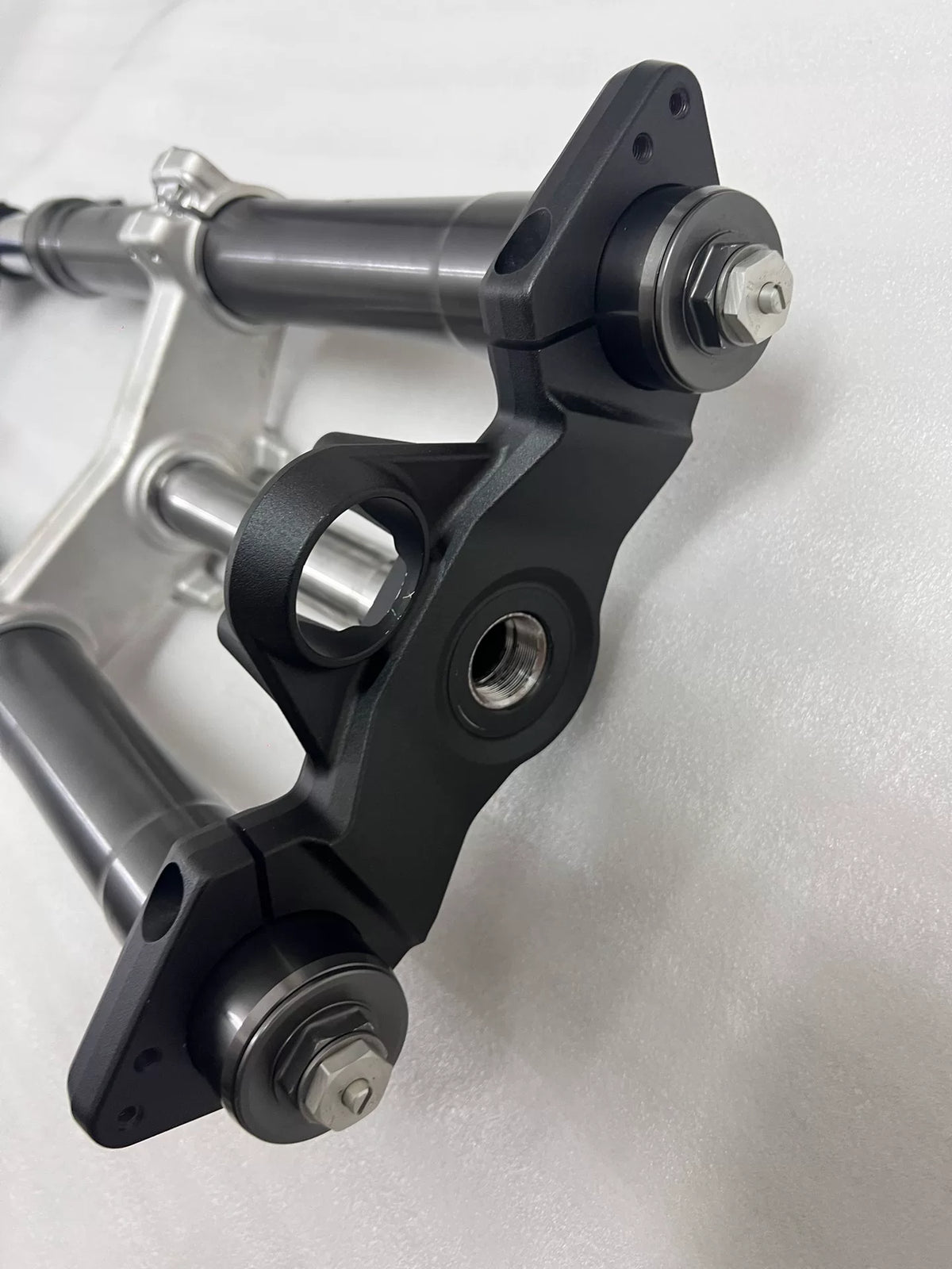 Upper triple clamp top view showing stem and handlebar mounts, Ninja 1000SX fork assembly