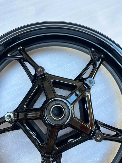 BMW S1000RR front wheel partial angle showing valve stem hole and rim edge condition