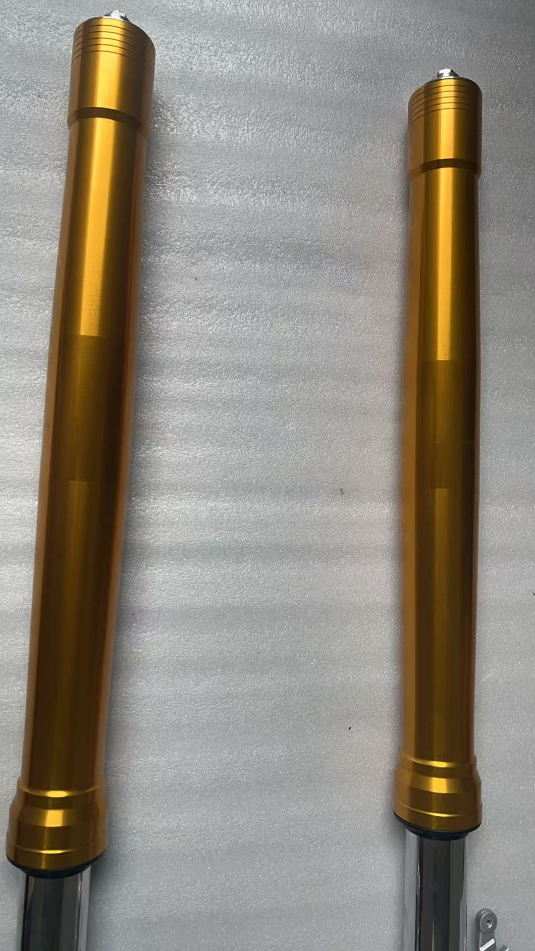 Aprilia RS 660 front fork close-up of upper tube and crown clamp area, side angle detail