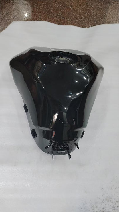 Rear angle of black Kawasaki ZX6R fuel tank showing filler cap recess and mounting tabs