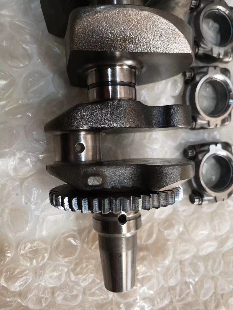 YZF-R1 crankshaft tapered end with timing gear, polished journal and oil hole detail