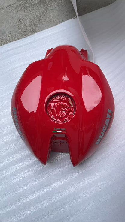 Top-down view of red Ducati Monster 821 tank with fuel cap opening, DUCATI decals and Italian flag 821 badge