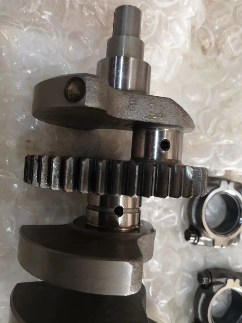 Close-up of YZF-R1 crankshaft center primary drive gear, journal and oil hole detail