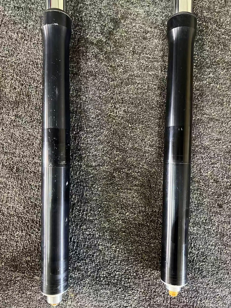 Yamaha YZF-R6 fork lower legs side by side, black anodized bodies with minor surface marks, 2008-2016