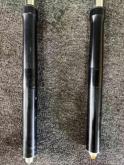 Yamaha YZF-R6 fork lower legs side by side, black anodized bodies with minor surface marks, 2008-2016