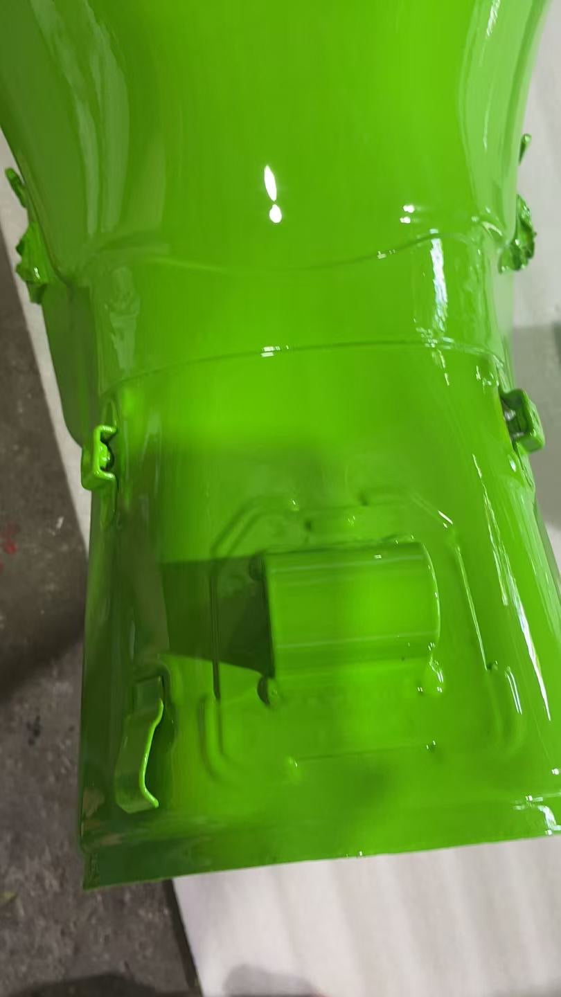 Close-up of rear underside of green ZX10R tank, tunnel seam, side clips and stamped bracket detail