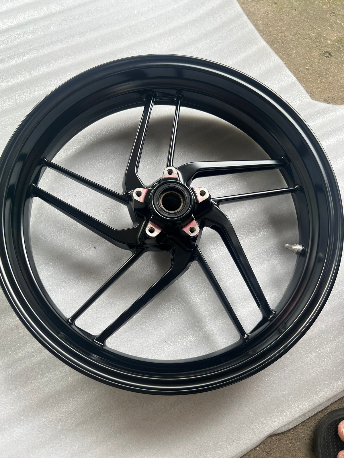 Ducati Monster 821 front wheel, side profile view showing spokes and hub detail, used condition