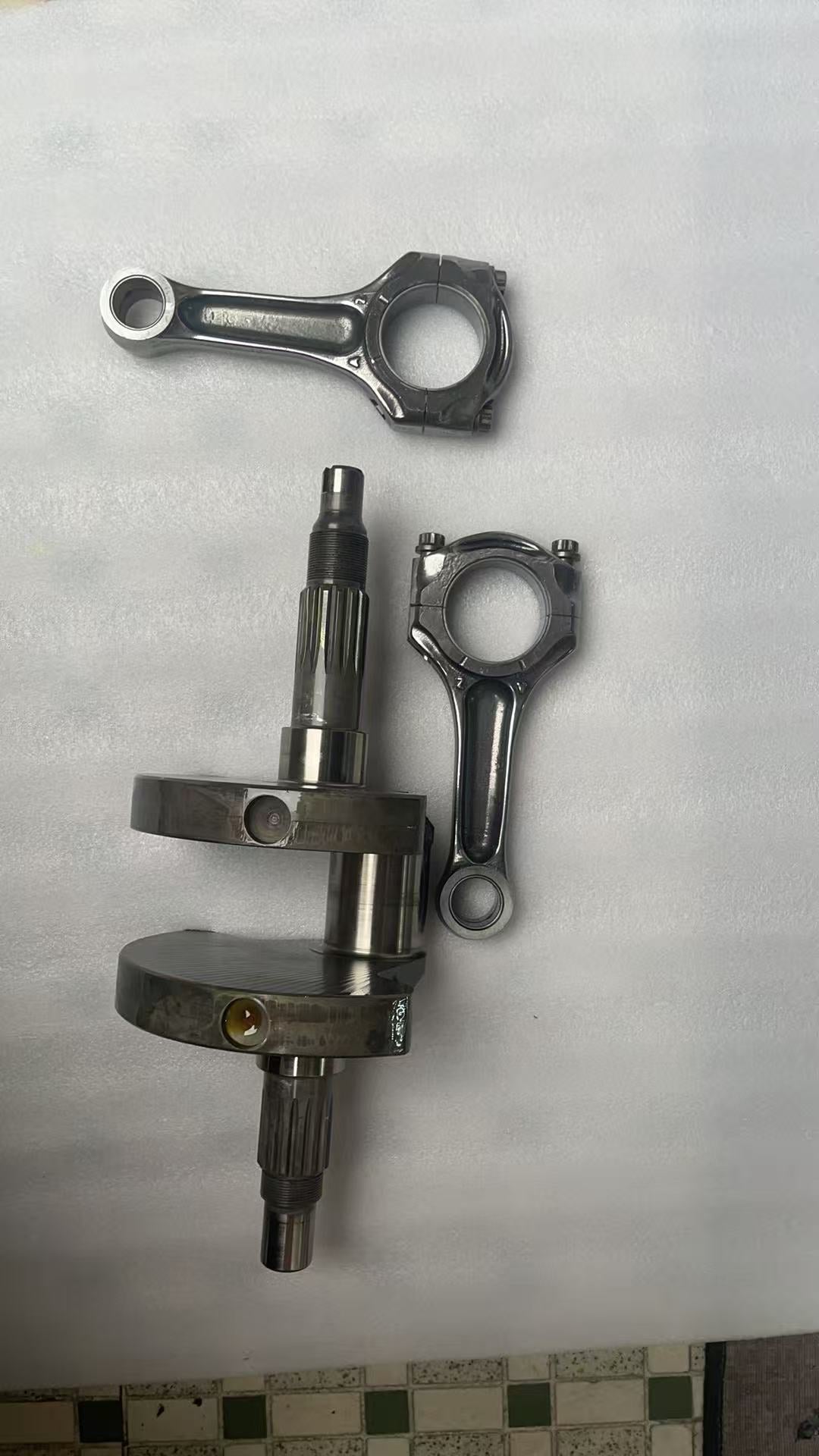 OEM Ducati Multistrada 1200 crankshaft assembly with rotor and connecting rods, full front view showing overall condition