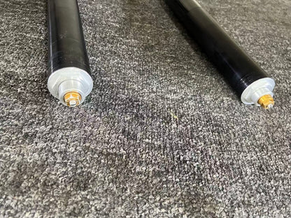 Yamaha YZF-R6 08-16 fork bottoms showing gold rebound adjuster bolts and silver spring seat caps
