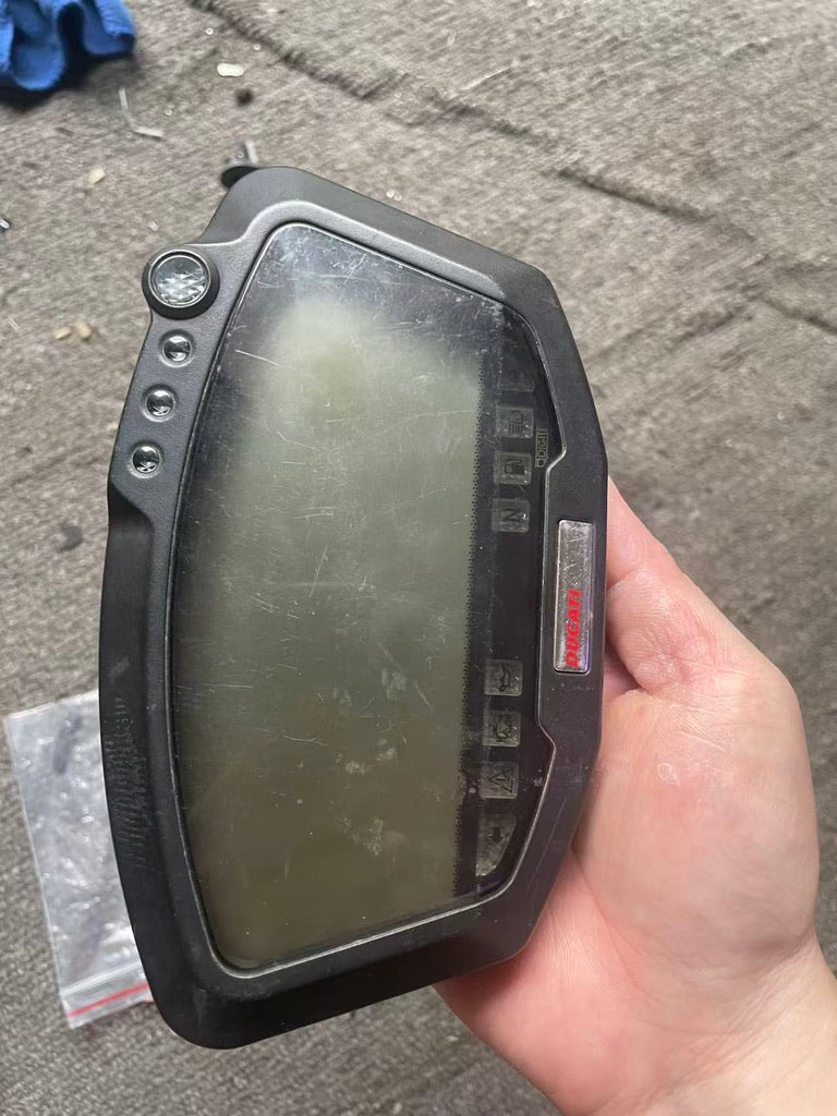 Ducati 848 instrument cluster angled view displaying dual gauge faces and housing detail