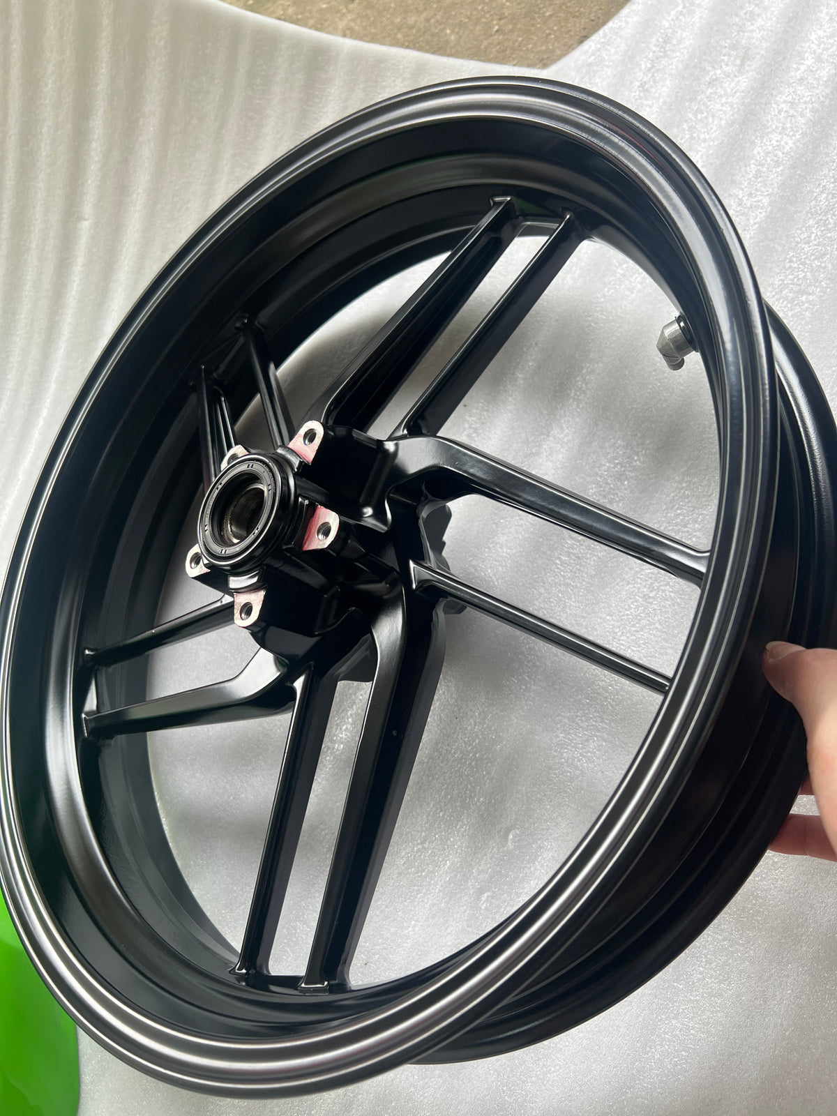 Ducati Monster 821 front wheel, angled view displaying brake disc rotor and spoke pattern