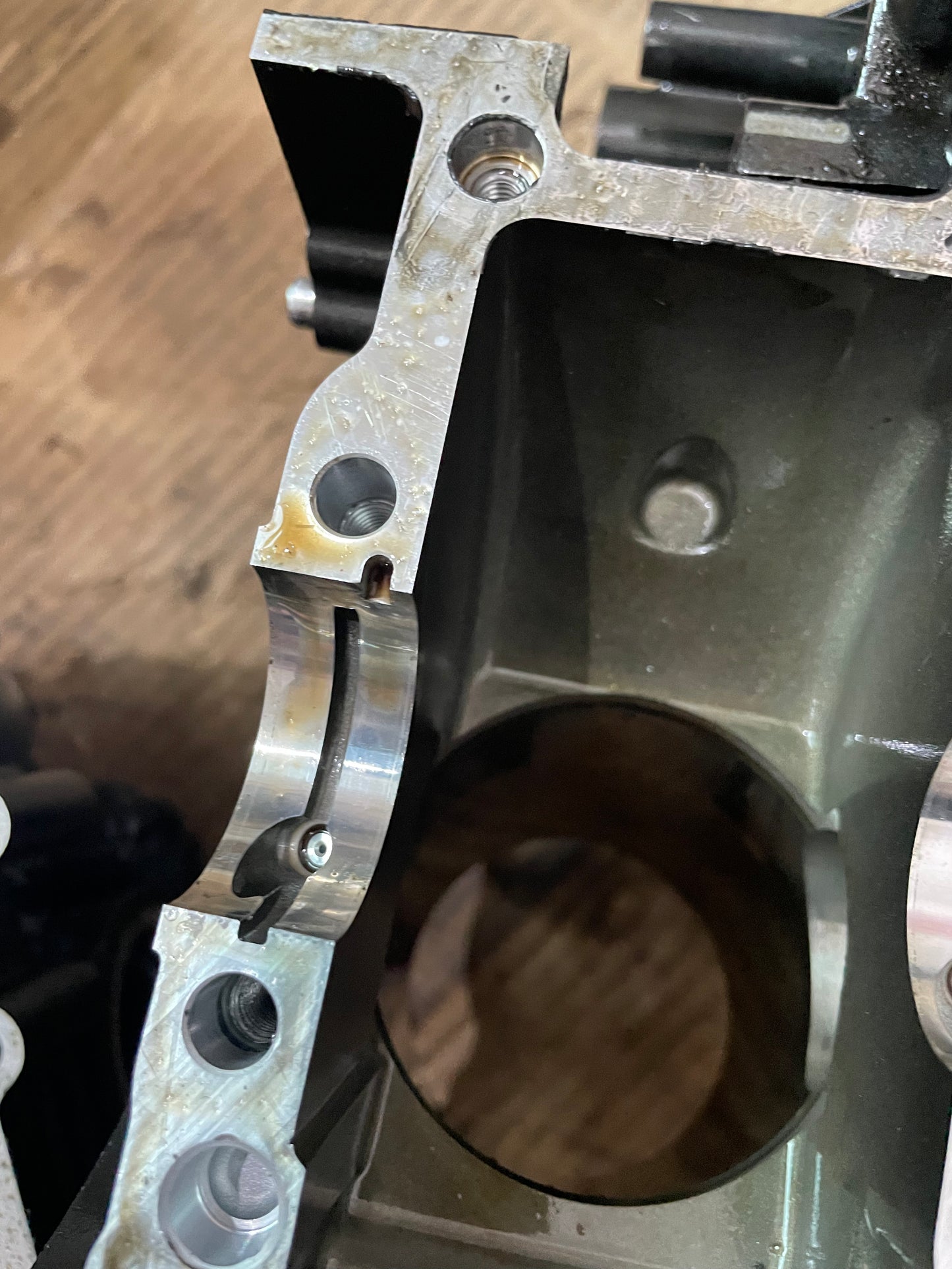 Detail of YZF-R6 crankcase corner showing threaded holes and main bearing shell seam
