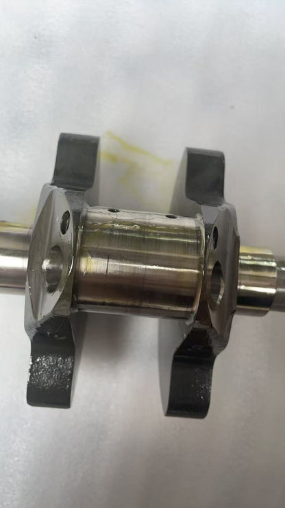 Close-up detail of connecting rod big-end and bearing cap bolts on Ducati MTS1200 crankshaft assembly