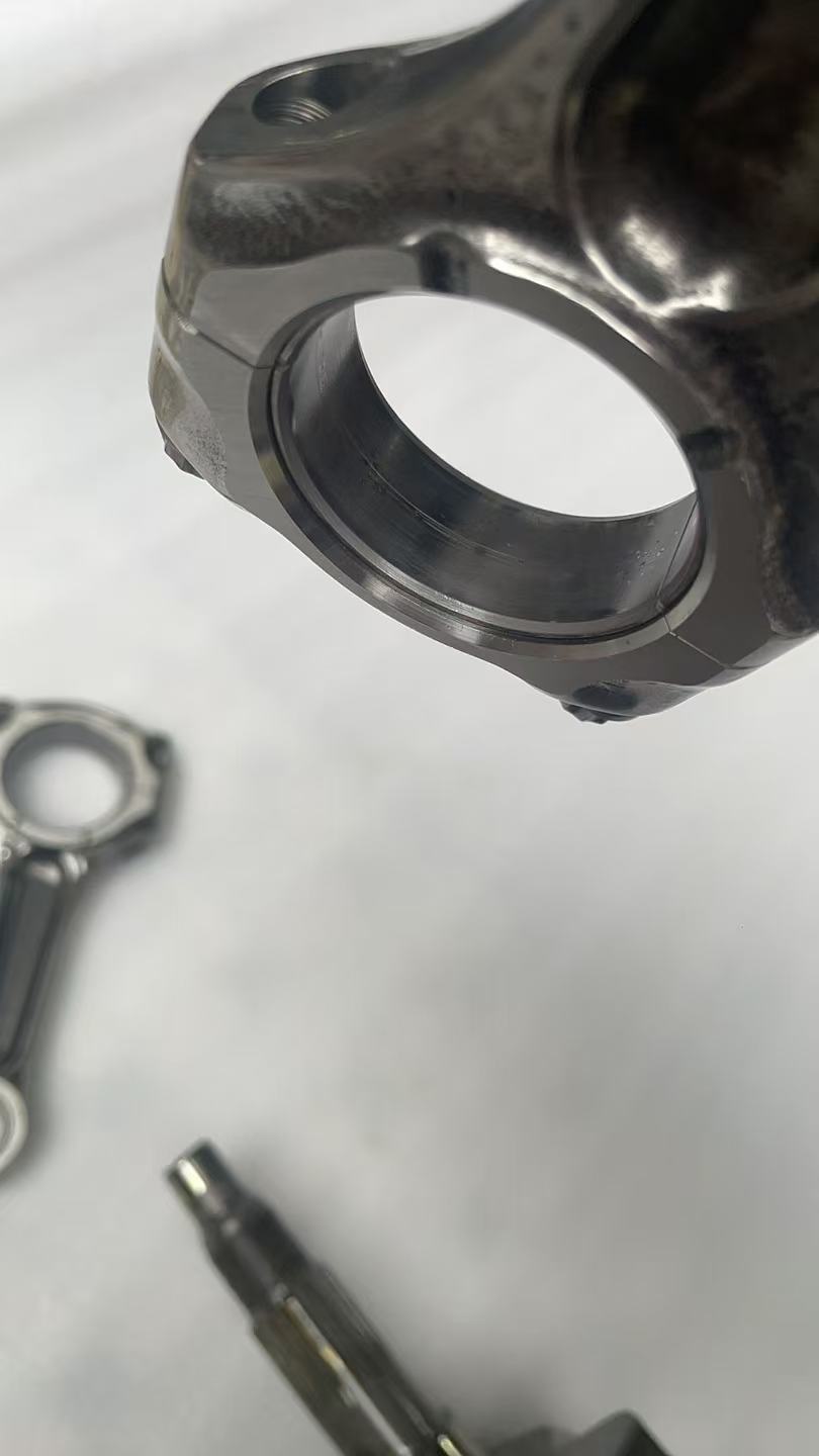 Ducati MTS1200 crankshaft rotor end close-up, showing flywheel magnets and outer rotor face in used condition