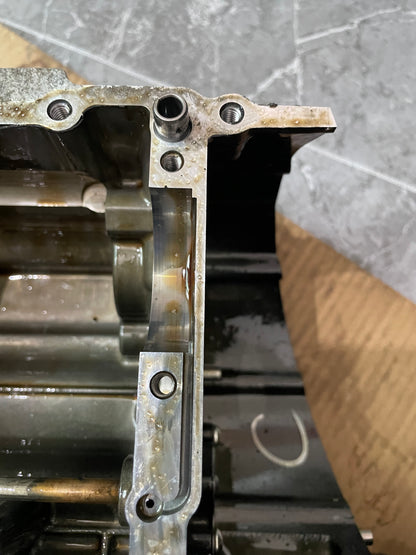 Side view of YZF-R6 crankcase mating flange edge, machined surface and bearing bore visible
