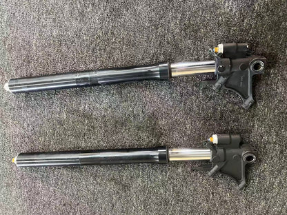 Yamaha YZF-R6 front fork set OEM 2008-2016, both legs with axle brackets and chrome tubes on carpet