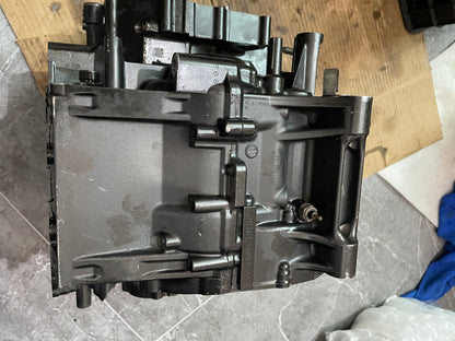 Exterior side of YZF-R6 crankcase half with cast markings and sensor port, painted black