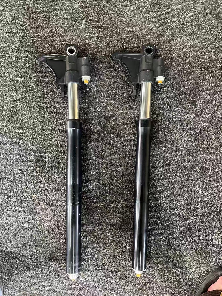 Yamaha YZF-R6 front fork set OEM 2008-2016, both forks laid out full-length on carpet, black lowers with chrome tubes