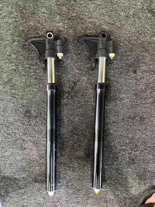 Yamaha YZF-R6 front fork set OEM 2008-2016, both forks laid out full-length on carpet, black lowers with chrome tubes