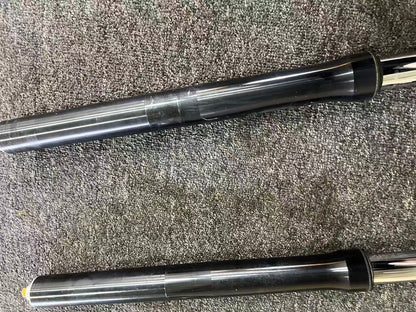 Yamaha YZF-R6 2008-2016 fork mid-sections close-up, black tubes with slight scuffing on carpet