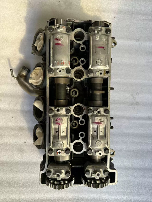 Top valvetrain view of Yamaha YZF-R1 cylinder head, dual camshafts, cam caps and sprockets, used
