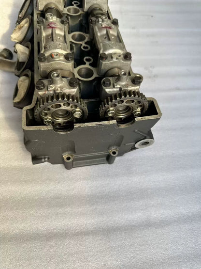 Top view of Yamaha YZF-R1 cylinder head end, twin cam sprockets and cap bolts visible, used