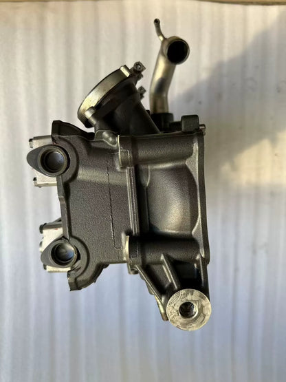 Yamaha YZF-R1 cylinder head end view showing coolant pipe stub and mounting bores, used condition