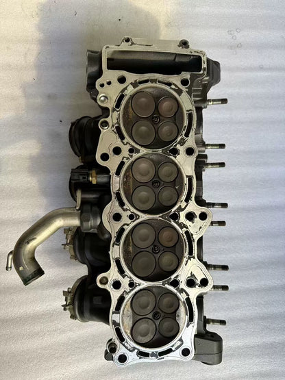 Gasket-face view of Yamaha YZF-R1 cylinder head, 4 combustion chambers with 16 valve faces, used